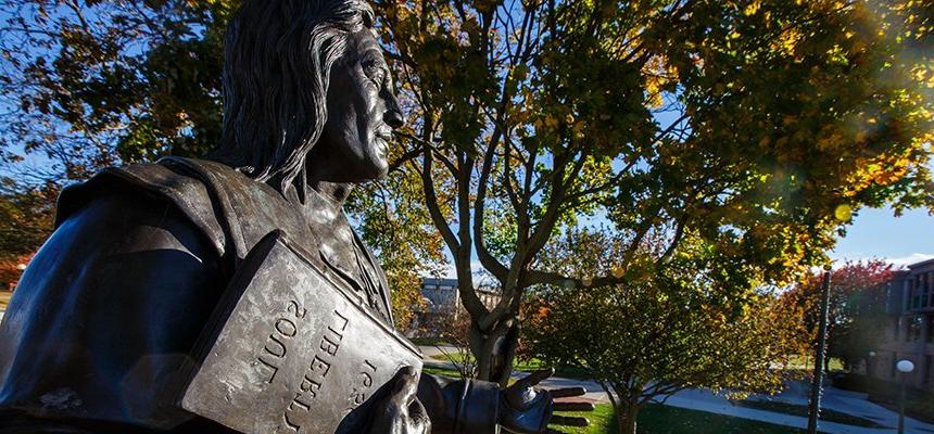 image of a close-up of Roger statue on fall day on RWU's Bristol campus